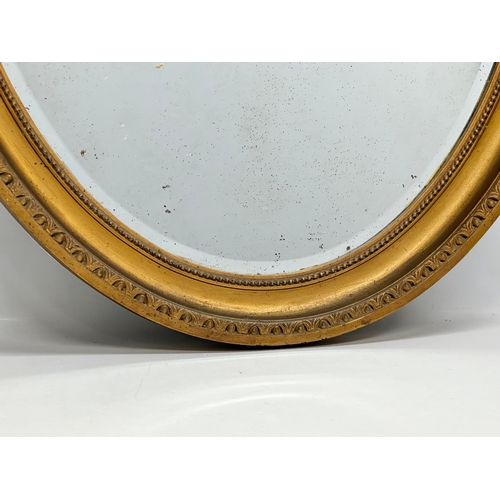 401 - A large Late 19th Century Victorian gilt framed mirror. 69x101cm.