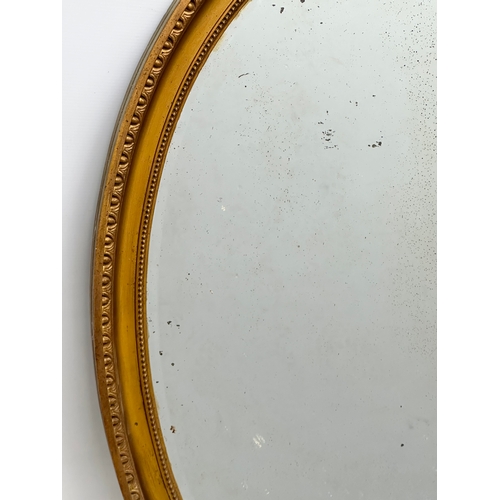 401 - A large Late 19th Century Victorian gilt framed mirror. 69x101cm.