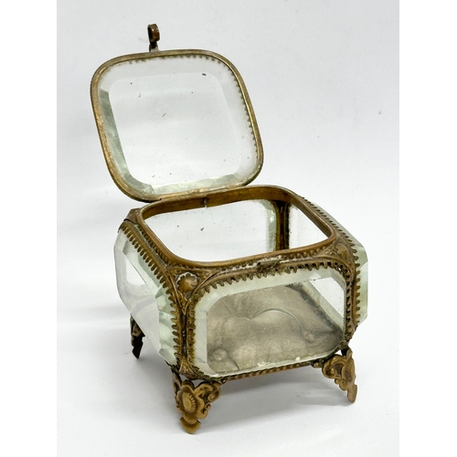 728 - A Late 19th Century pocket watch case, with gilt brass frame and 5 bevelled glass panels. 8x8x7cm.