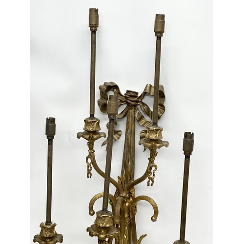 365 - A pair of large Mid 20th Century brass wall lights. 33x70cm