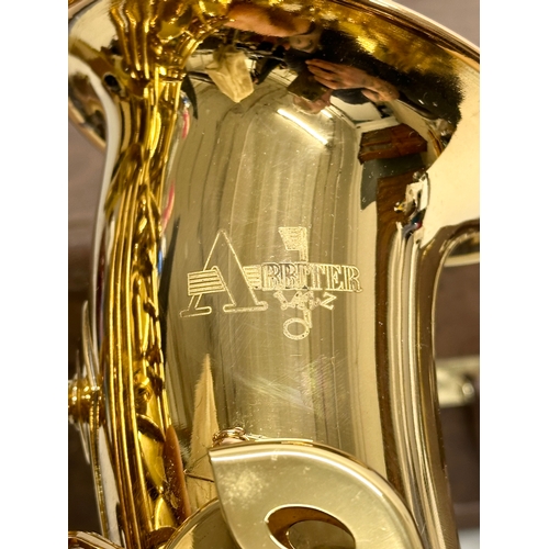 765 - An Arbiter Jazz saxophone with case.