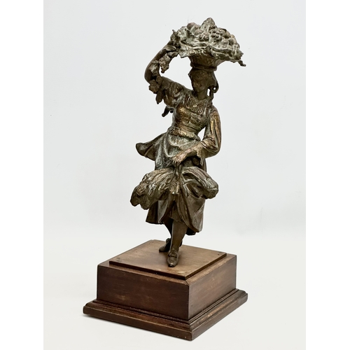 428 - A large 19th Century spelter harvest lady on stand. 18x18x44cm.