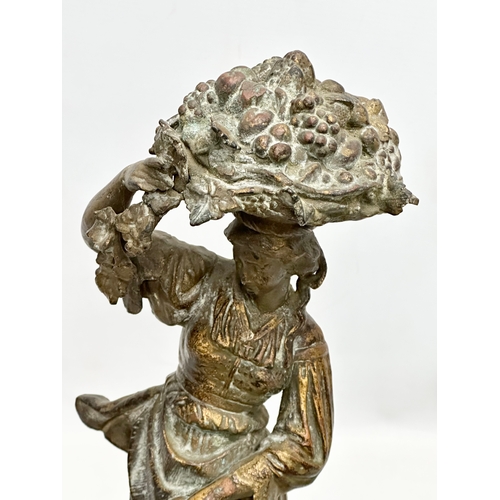 428 - A large 19th Century spelter harvest lady on stand. 18x18x44cm.