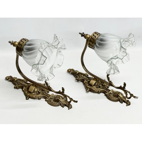 959 - A pair of Mid 20th Century brass wall lights with glass shades. 32x25cm