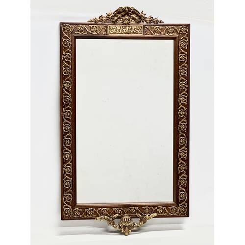 331 - A large Neo Classical style gilt brass and mahogany framed mirror. 58x101cm