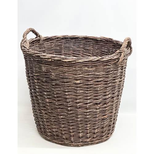 441 - A large vintage wicker basket. 62x58cm