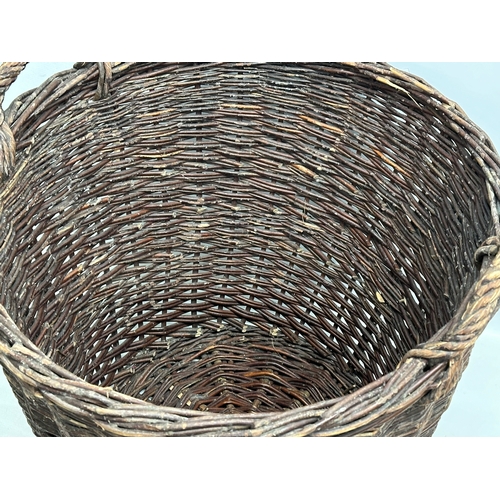 441 - A large vintage wicker basket. 62x58cm