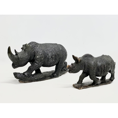 800B - 2 large soapstone rhinos. 40cm. 28cm.