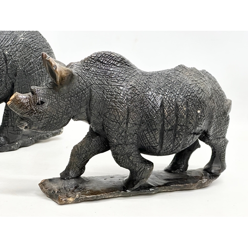 800B - 2 large soapstone rhinos. 40cm. 28cm.