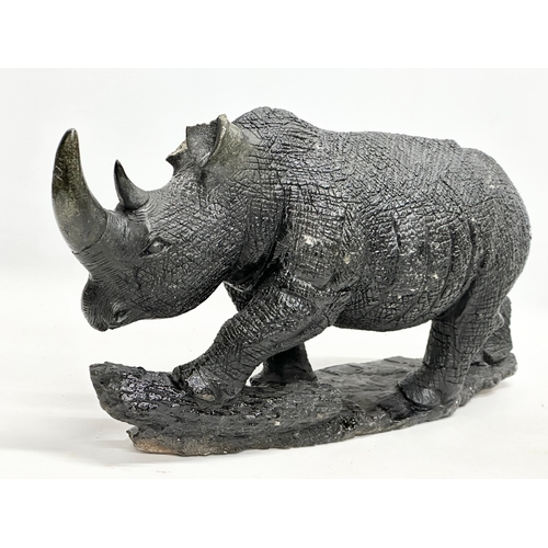 800B - 2 large soapstone rhinos. 40cm. 28cm.