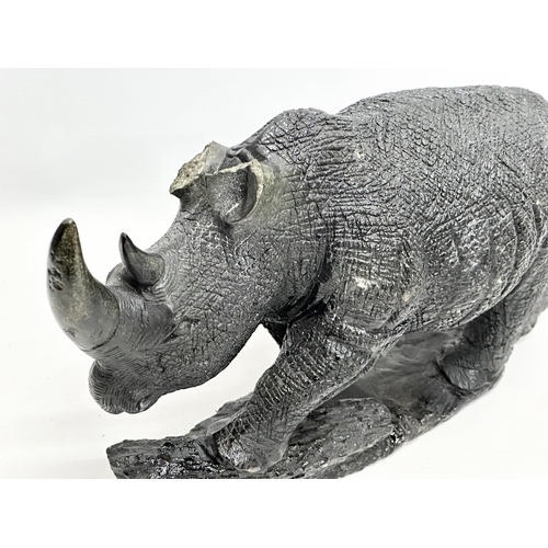 800B - 2 large soapstone rhinos. 40cm. 28cm.