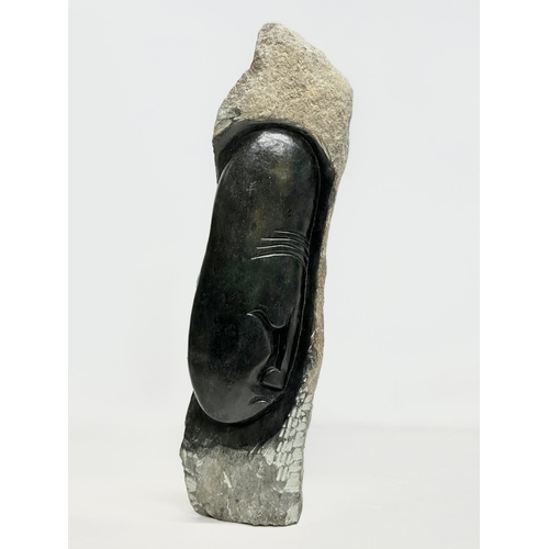 450 - A large carved soapstone and granite sculpture. 48cm