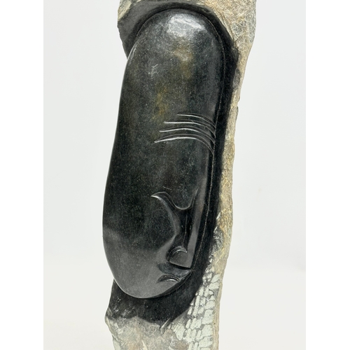 450 - A large carved soapstone and granite sculpture. 48cm