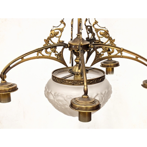 229 - A good quality Early 20th Century brass chandelier with glass shade. 63x77cm