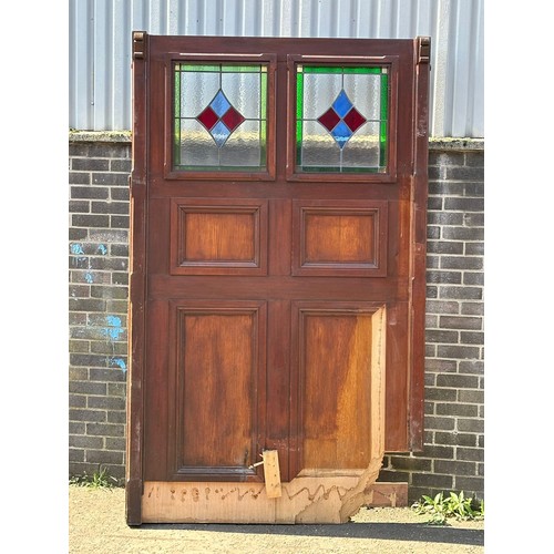 451 - A very large mahogany framed double sided panel with 2 stained glass windows. 149x240cm