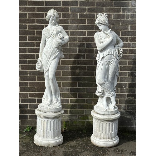 453 - A pair of large concrete garden figures on stands. 165cm