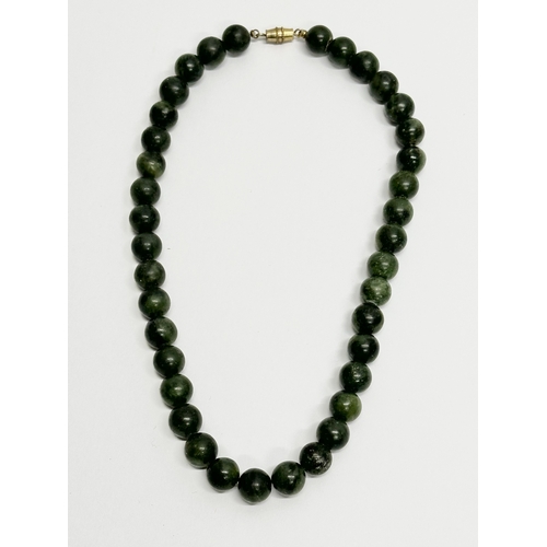 288 - 2 ladies jade necklaces.