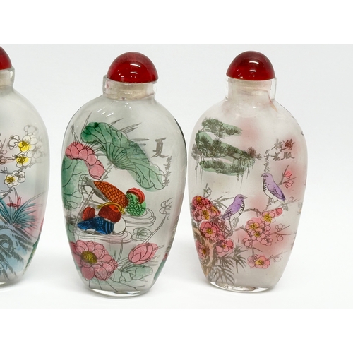 294 - A set of 4 20th Century Chinese glass scent bottles/snuff bottles.