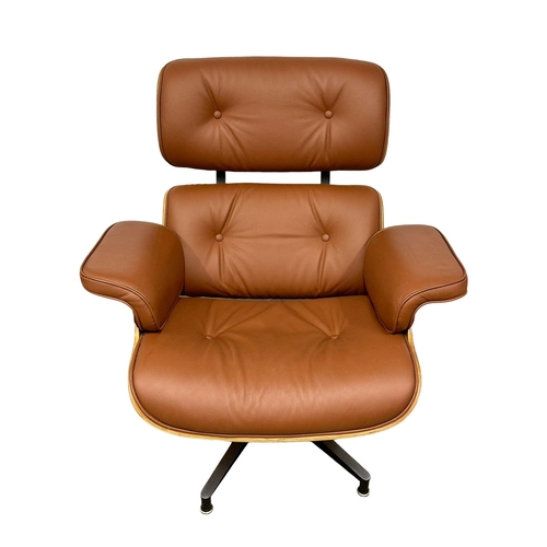 1 - A Charles & Ray Eames style leather swivel chair and ottoman. With rosewood veneer and chrome base. ... 