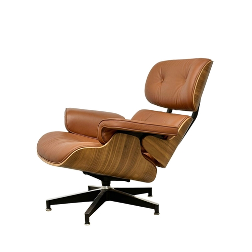 1 - A Charles & Ray Eames style leather swivel chair and ottoman. With rosewood veneer and chrome base. ... 