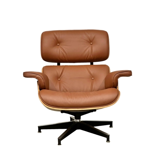 1 - A Charles & Ray Eames style leather swivel chair and ottoman. With rosewood veneer and chrome base. ... 