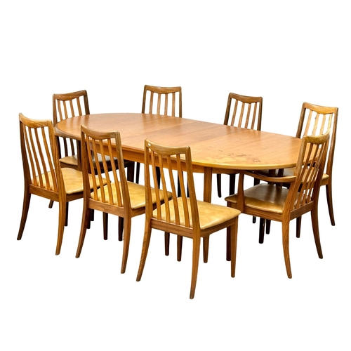 104 - A G-Plan “Fresco” Mid Century teak extending dining table and 8 chairs, with original leather seats.... 