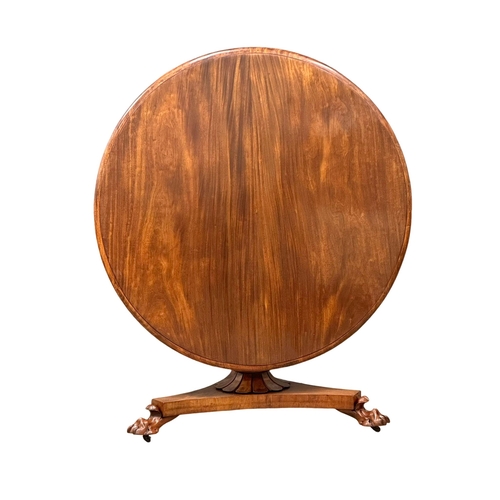 118 - A William IV mahogany tilt top pedestal breakfast table/dining table, on lion paw feet. Circa 1830. ... 