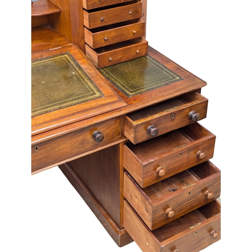 119 - A 19th Century Victorian mahogany Dickens desk with original leather top. 145x70x108.5cm. 3