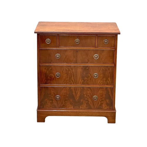 141 - Waring & Gillow. An Early 20th Century mahogany chest of drawers on bracket feet. By Waring & Gillow... 