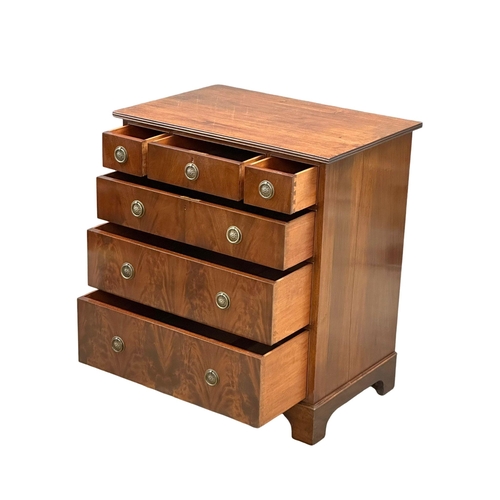 141 - Waring & Gillow. An Early 20th Century mahogany chest of drawers on bracket feet. By Waring & Gillow... 