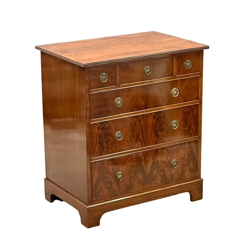 141 - Waring & Gillow. An Early 20th Century mahogany chest of drawers on bracket feet. By Waring & Gillow... 