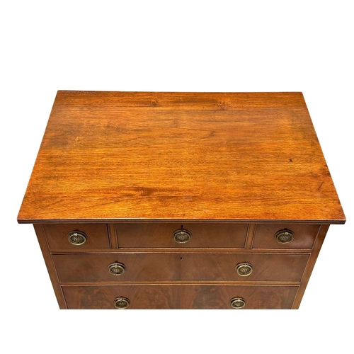 141 - Waring & Gillow. An Early 20th Century mahogany chest of drawers on bracket feet. By Waring & Gillow... 