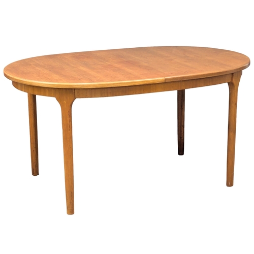 146 - A McIntosh Mid Century teak extending dining table designed by Tom Robertson. 205x98x76.5cm extended... 