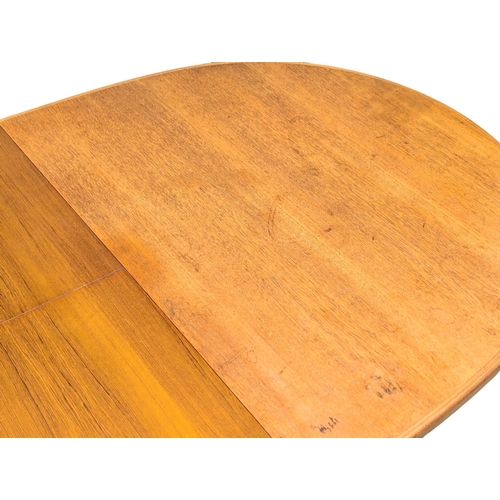 146 - A McIntosh Mid Century teak extending dining table designed by Tom Robertson. 205x98x76.5cm extended... 