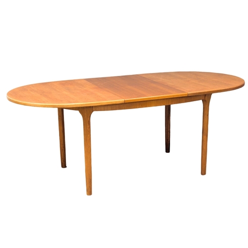 146 - A McIntosh Mid Century teak extending dining table designed by Tom Robertson. 205x98x76.5cm extended... 