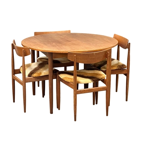 15 - A G-Plan Mid Century teak extending dining table and 4 chairs. Closed 111.5x72.5cm. Open 150.5x111.5... 