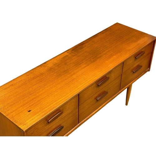 169 - Frank Guille for Austinsuite. A 1960’s Mid Century teak sideboard. Designed by Frank Guille for Aust... 