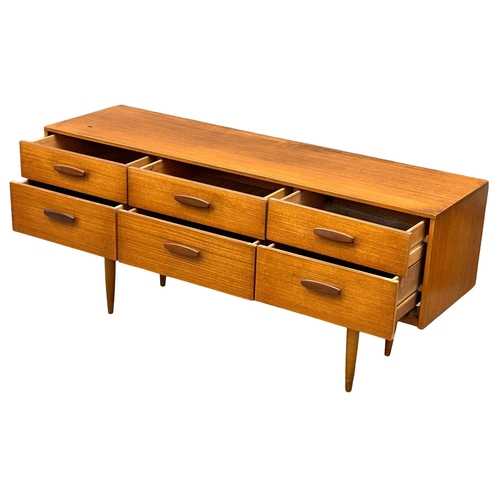 169 - Frank Guille for Austinsuite. A 1960’s Mid Century teak sideboard. Designed by Frank Guille for Aust... 