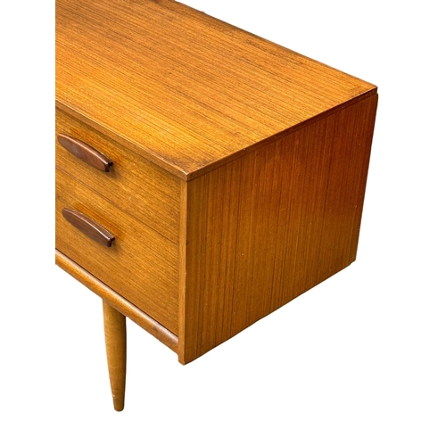 169 - Frank Guille for Austinsuite. A 1960’s Mid Century teak sideboard. Designed by Frank Guille for Aust... 