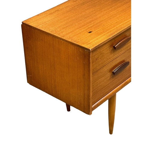 169 - Frank Guille for Austinsuite. A 1960’s Mid Century teak sideboard. Designed by Frank Guille for Aust... 