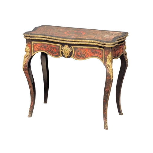 17 - A Napoleon III French turnover games table with boulle work, brass inlay, and ormolu mounts on Cabri... 