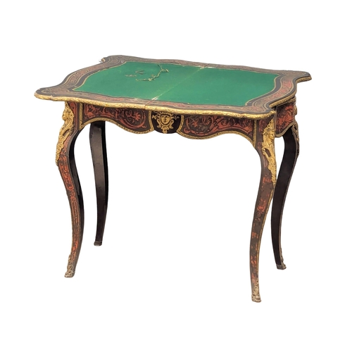 17 - A Napoleon III French turnover games table with boulle work, brass inlay, and ormolu mounts on Cabri... 