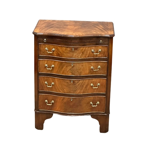 174 - An Early 20th Century Chippendale Revival mahogany serpentine front bachelors chest, on bracket feet... 