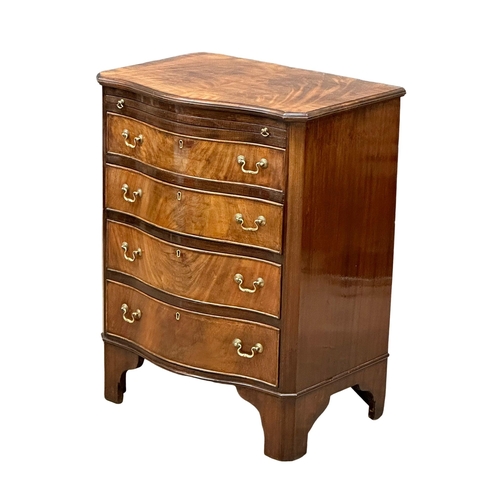 174 - An Early 20th Century Chippendale Revival mahogany serpentine front bachelors chest, on bracket feet... 