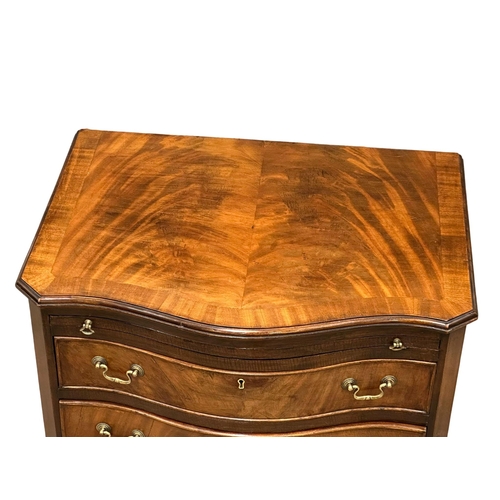 174 - An Early 20th Century Chippendale Revival mahogany serpentine front bachelors chest, on bracket feet... 