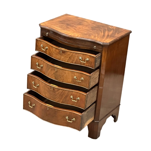 174 - An Early 20th Century Chippendale Revival mahogany serpentine front bachelors chest, on bracket feet... 