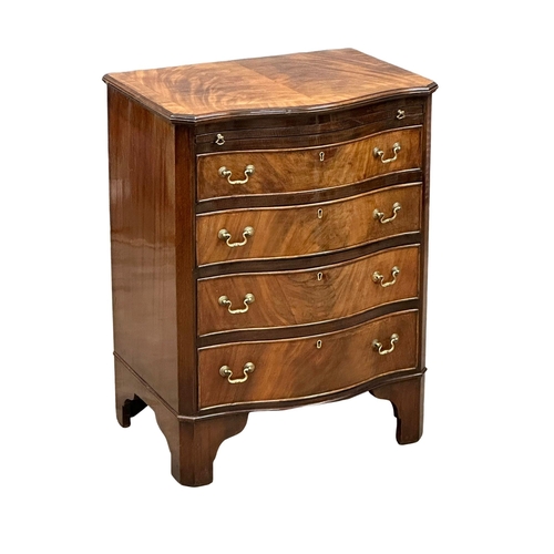 174 - An Early 20th Century Chippendale Revival mahogany serpentine front bachelors chest, on bracket feet... 