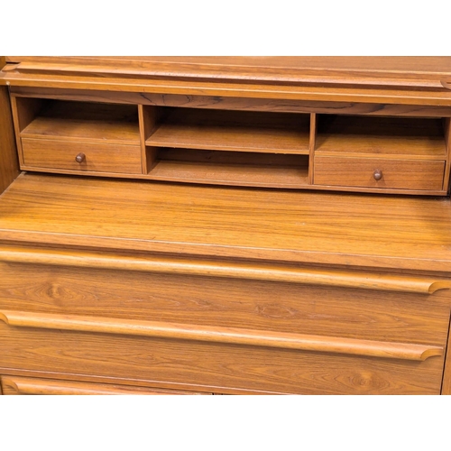 225 - A Danish Mid Century teak cylinder writing bureau. 90x48x100cm (3)