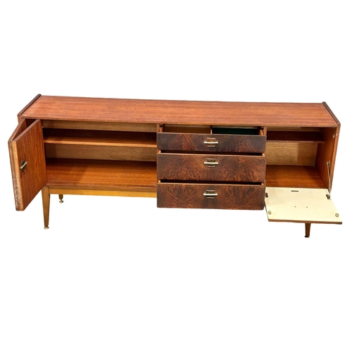 228 - A Mid Century teak and rosewood sideboard by Stonehill. 182x43x75cm. 5