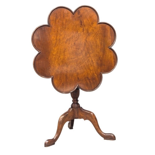 262 - An Early - Mid 20th Century revolving mahogany pedestal tilt top lamp table. 68x68cm (3)